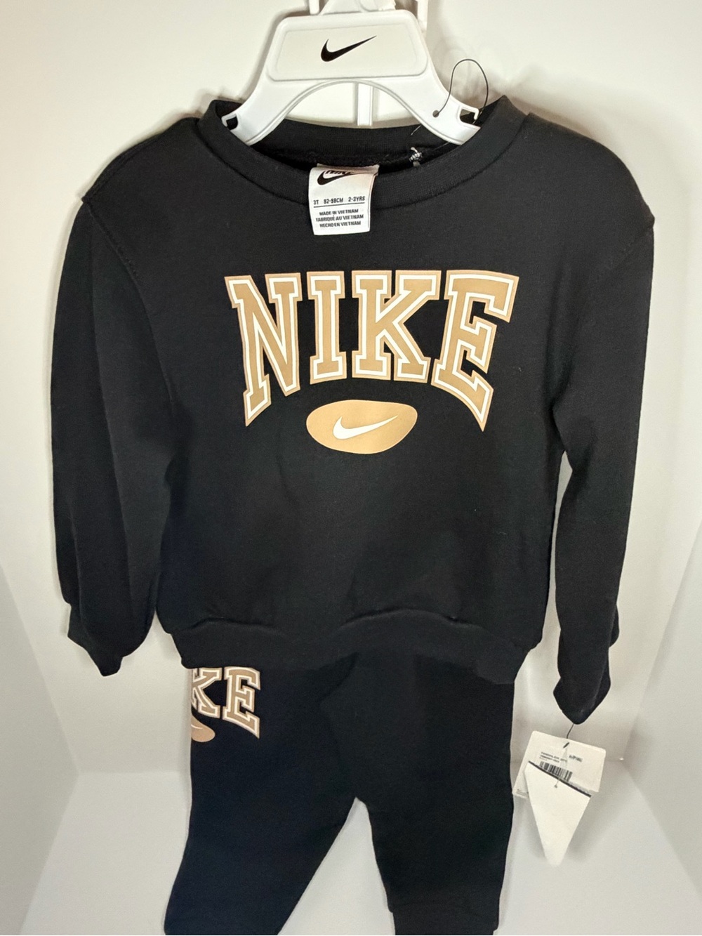 Nike Black Sweatshirt with Tan Logo and Collegiate Graphic
